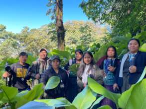 Participants and the guide together in the forest