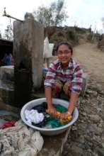 Girl washing her clothes