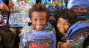 Children with their new school bags in Yemen.