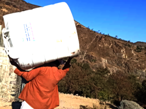 Delivering water tanks to families in need