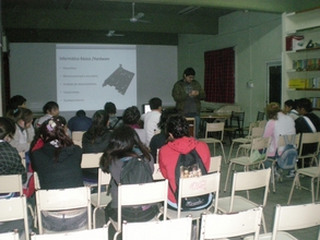 Students getting a basic IT lesson