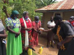 Passing out corn flour.