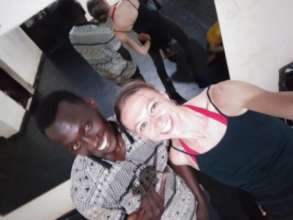 Emmanuel in class with MindLeaps' Rebecca Davis