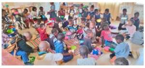 Pre-schoolers having breakfast