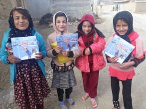 Young girls receiving the books, Kapisa province