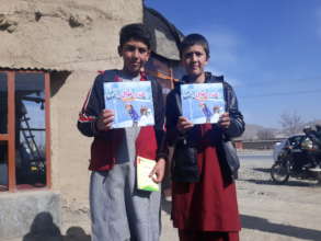 Children receiving the books, Kapisa province
