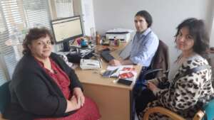 Two Ukranian-Armenians with CAIA's Advice Worker