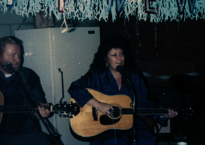 Barb McCue performing with her late brother