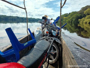 Transporting equipment to Lilungu via riverboat