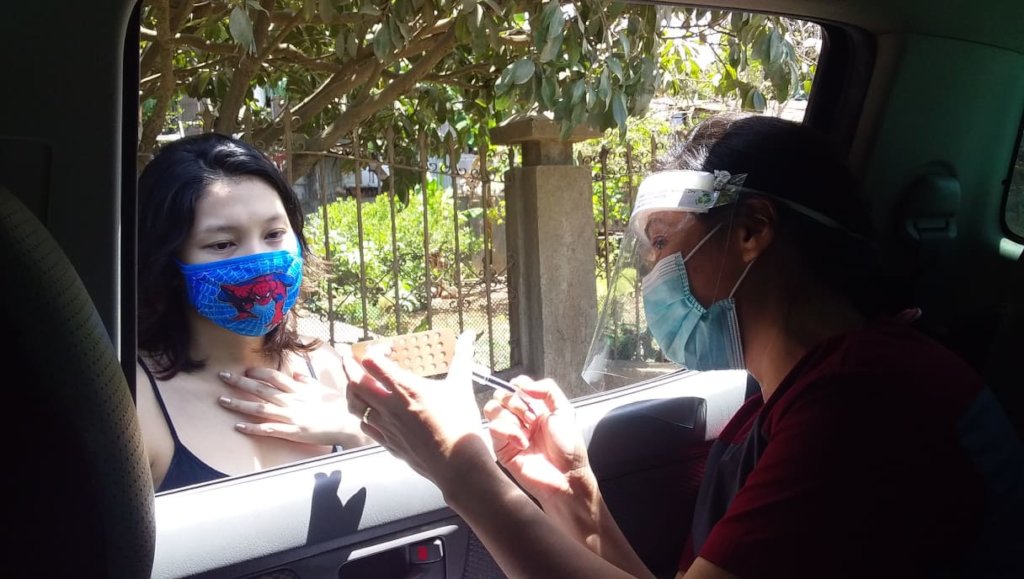 Nurse Daisy providing info on pills from our car