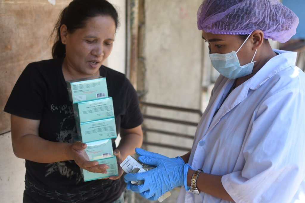 Nurse Shery providing pills to a govt partner