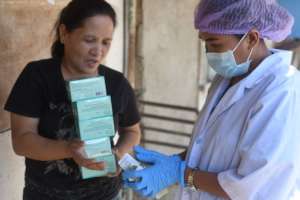 Nurse Shery providing pills to a govt partner