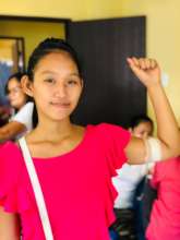 Janet* showing off her new contraceptive implant