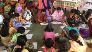 Women in the group discussion writing ,"who am I?"
