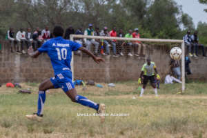 Uweza Soccer Academy participating in a match