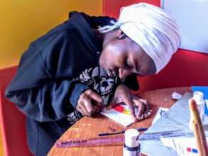 Mwanaidi from Cohort 5 during an art class