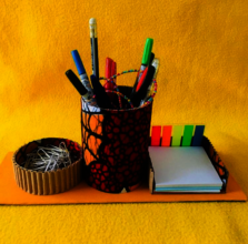 desk item made by youth using recycled papers