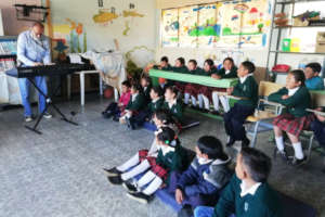 Calixto sharing to children first music lesson