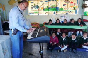 Calixto sharing to children first music lesson