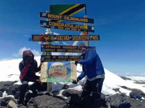 Jerry and Ikirwa flag on top of Uhuru peak