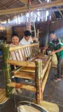 Students finishing up their bamboo armchair