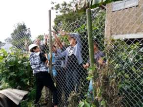 Students and teachers fencing the school