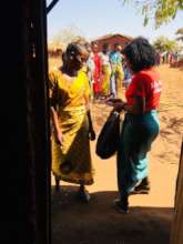 Giving facemask to people in chiwamba village