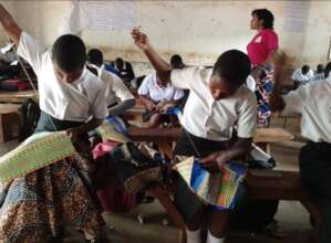 Girls learning how to sew at Minga school