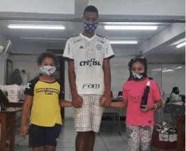 Sports teacher and pupils with ACER made masks