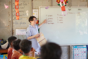 Lea teaching at Helping Hands school
