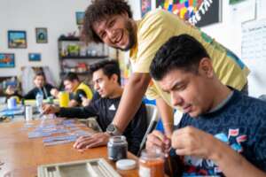 Fernando joyfully accompanying Alex and Alberto