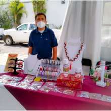 Gabriel selling the jewelry he makes