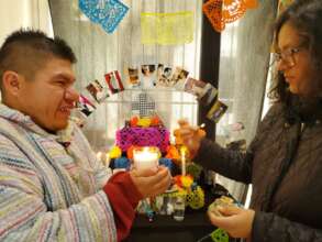 Juan Jose lighting a candle for the altar