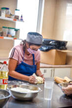 Juanita preparing bread in the bakery