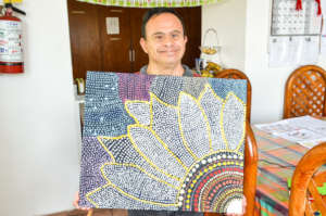 Moises shows us one of his latest paintings
