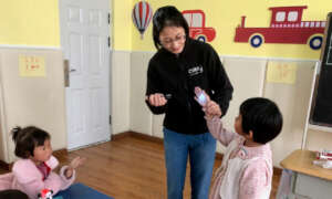Jenny of CWEF helps students see the unseen germs
