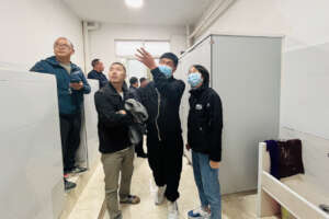 Inspecting new solar-heated shower rooms