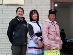 Meili (center) with her mother and Jenny Chu