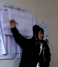Meili facilitates discussion during training
