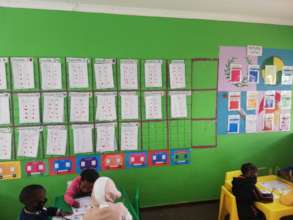 Children's work beautifully displayed on the wall.