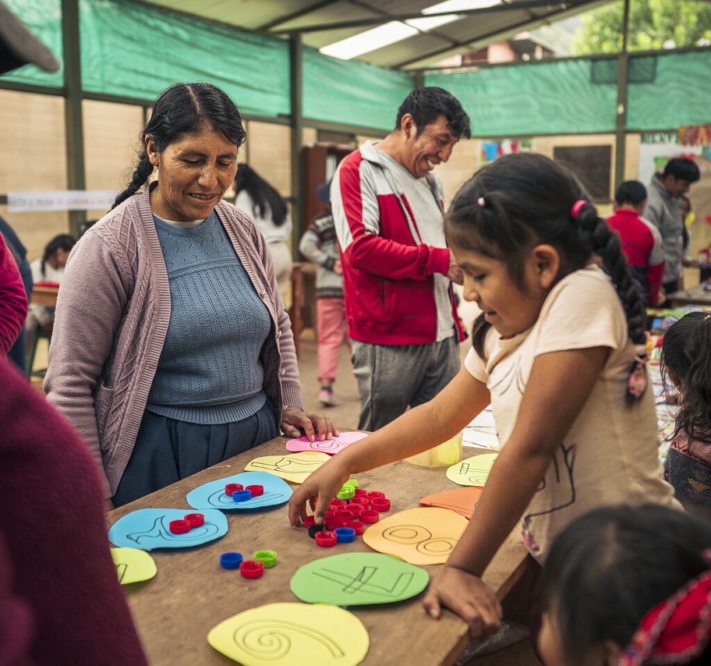 A mother participating in the community fair