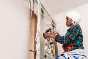 Weaver using a beater