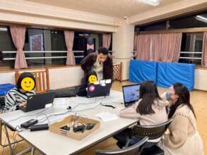 Kids using the donated laptops