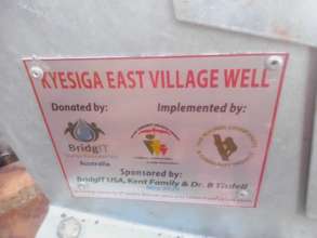 Plaque on completed Kyesiga East Well