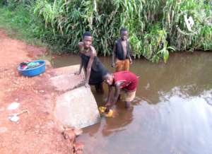 Villagers collecting water from open source