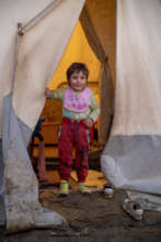 Naim's daughter outside the tent