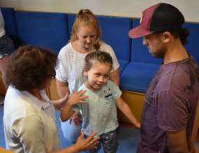 Eli and his family, learning a standing program