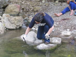 Taking water samplings for the water monitoring
