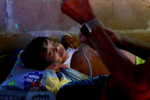 Burmese refugee child being examined