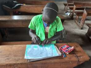 Student drawing an elephant for competition